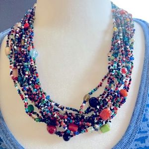 Multi strand, multi color, seed and glass beads necklace with clasp closure